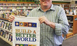 Mr. Brian with a "Build A Better World" Summer Reading Bag