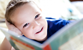 Kid Reading in Bed