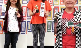 Winners of the 2019 Bookmark Contest with their bookmarks and trophies