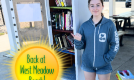 Back at West Meadow Beach. Teen volunteer standing in front of Little Free Library.