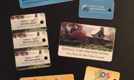 New library cards laid out on table