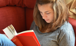 Teen girl reading a book