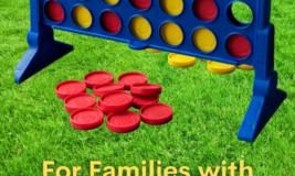 Close up of lawn with giant Connect 4 game. Text: For Families with Babies - 6th Graders